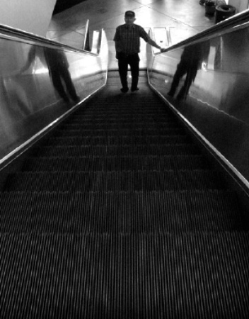 Man on an Escalator