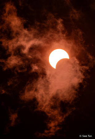 Solar Eclipse with Clouds