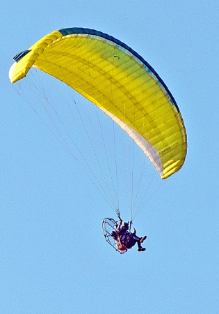 Man on motor parachute.