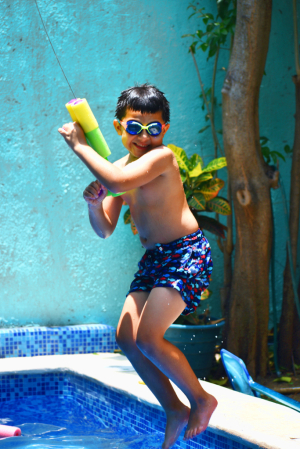 HAVING FUN AT THE SWIMMING POOL