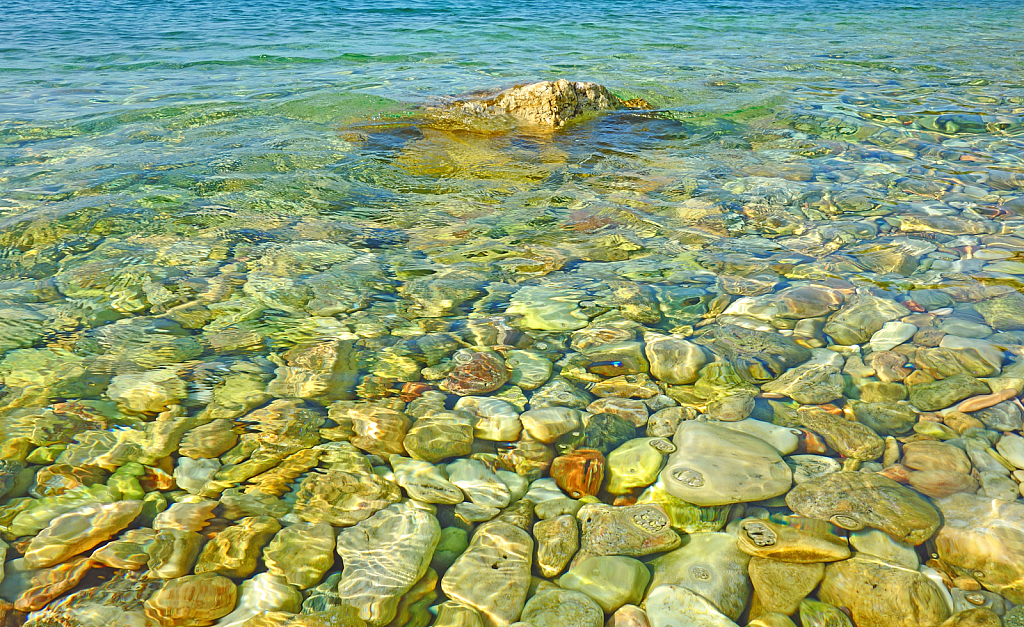 Pebbles at Sea. Abstract.