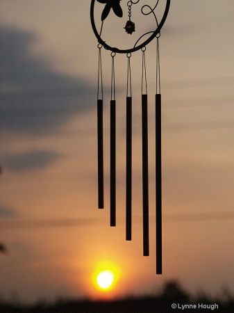 Windchimes in silhouette