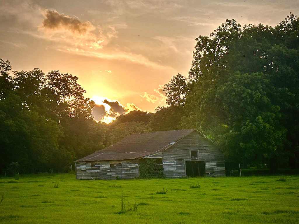 Old barn at sunset