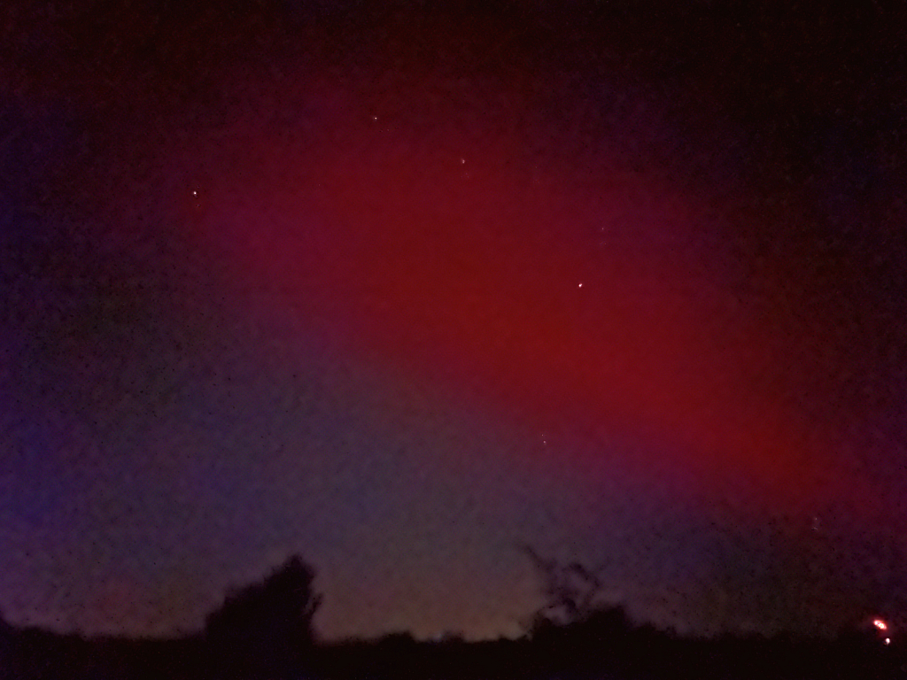 Red Aurora streak in the sky 