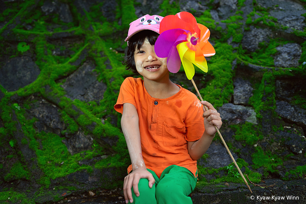 Little Girl and Colorful Fan