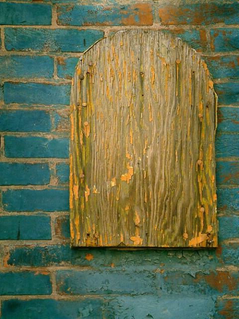 Old Wood on Painted Brick