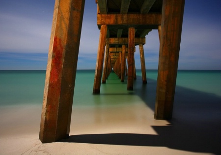 Beneath the Gulf Pier Under a Full Moon