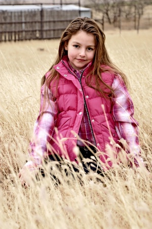 Girl in tall grass