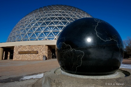 a dome, a globe, and the sun