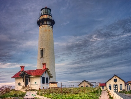 Lighthouse and Red Roofs