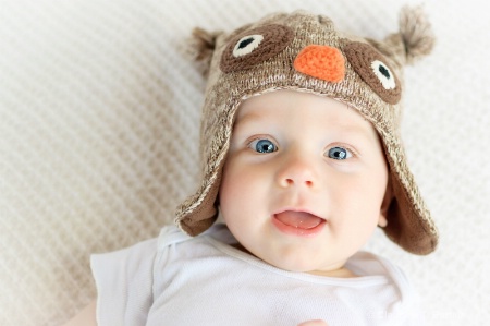 Happy in his owl hat