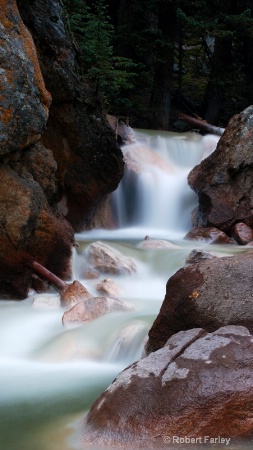 mountain stream and red rocks