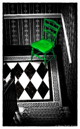 Green Chair at the Bottom of the Stairs