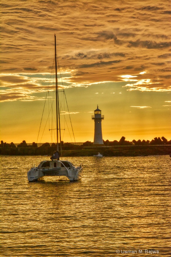 A Lighthouse and a Catamaran